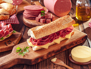 Mortadella sandwich with butter, bread and spices on wood cutting board © Marcio Tibilletti