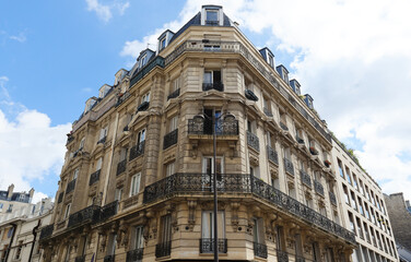 Obraz premium Traditional French house with typical balconies and windows. Paris.