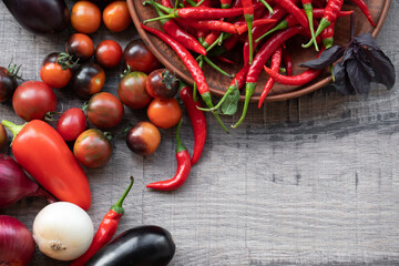 Fresh vegetables on wooden background.