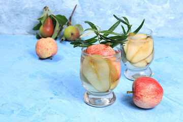 Apple and pear cider, juice or fruit drink and ingredients on a sunny table. The concept of diet...