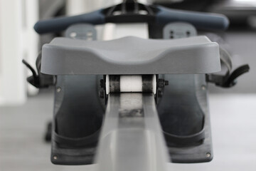 A closeup shot of a rowing machine with an interesting perspective