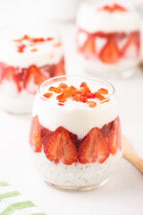 Breakfast of Greek Yogurt Glass with chia and strawberries. Step by step.