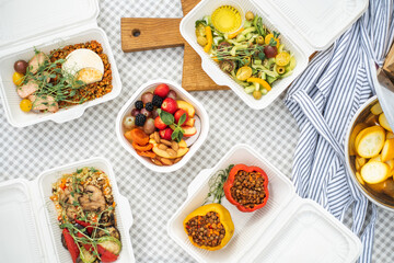 Sat of take away boxes with healthy food on the table. Restaurant dishes. Top view. Flat lay.