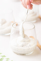 Breakfast of Greek Yogurt Glass with chia and strawberries. Step by step.