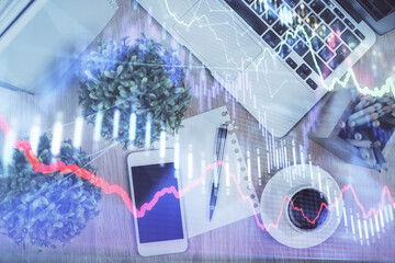 Multi exposure of financial chart hologram over desktop with phone. Top view. Mobile trade platform...