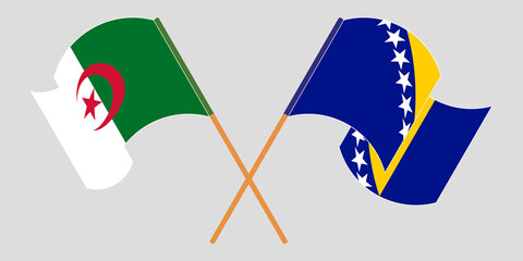 Crossed and waving flags of Algeria and Bosnia and Herzegovina