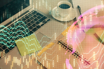 Multi exposure of forex graph drawing and desktop with coffee and items on table background. Concept of financial market trading