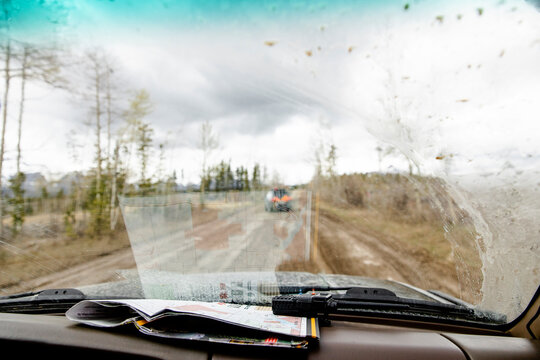 POV Map On Dashboard Of Overland SUV On Remote Dirt Road