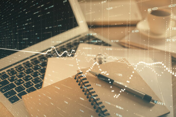 Double exposure of financial chart drawing and desktop with coffee and items on table background. Concept of forex market trading