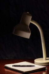 desk lamp and book