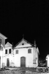 Black and white photo of  vintage catholic church in Brazil at night