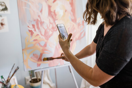 Artist Videoing Her Brush Strokes On Painting