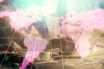 Double exposure of man and woman working together and financial theme hologram. international business concept. Computer background.