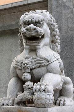 marble lion sculpture in a park