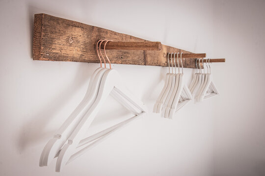 Vintage wooden coat hanger stand isolated on white background.. Vintage wooden coat hanger stand isolated on white background..