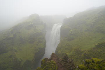 Waterfall path hike from skogar to thorsmork on a rainy cloudy day in august 2020