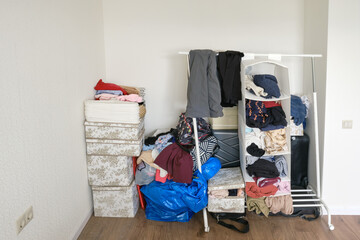 Pile of things and clothes without a wardrobe