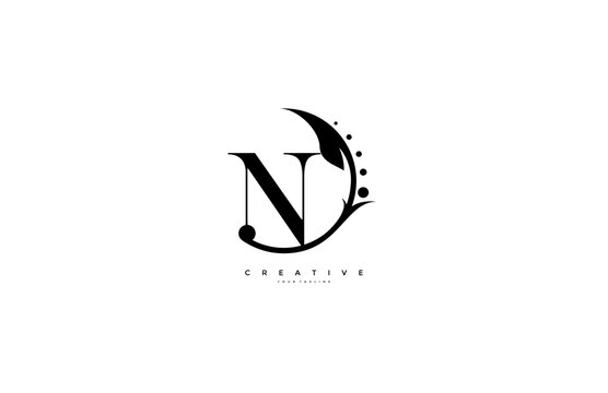 N letter rounded flourishes ornament monogram logo