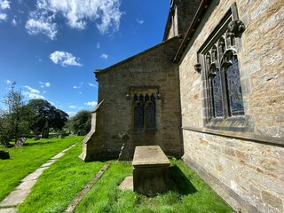 Fototapeta premium Side view, of an old church, on a sunny day in, Rylstone, Skipton, UK