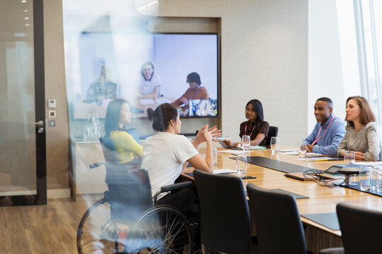 Business people talking and video conferencing in conference room