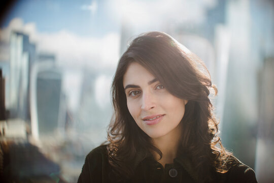 Portrait confident businesswoman at sunny window