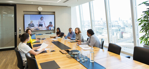Business people video conferencing in conference room meeting
