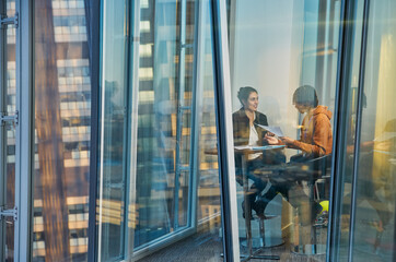 Business people meeting at highrise office window