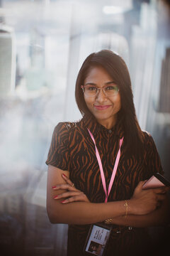 Portrait confident businesswoman with arms crossed