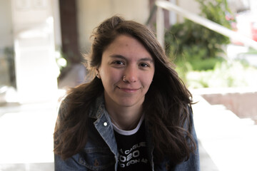 young positive cute woman looking straight ahead