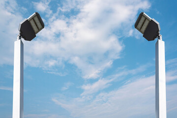 Led lights on white steel poles, energy saving technology separated from the background.