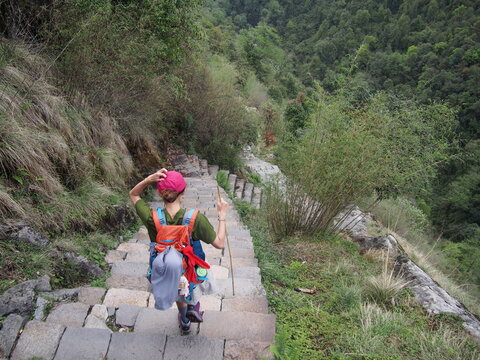 A woman trekking through beautiful nature, ABC (Annapurna Base Camp) Trek, Annapurna, Nepal, ABC (Annapurna Base Camp) Trek, Annapurna, Nepal