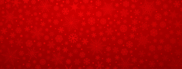 Christmas background of various complex big and small snowflakes, in red colors