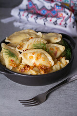 Dumplings, filled with potato. Varenyky, vareniki, pierogi, pyrohy - dumplings with filling