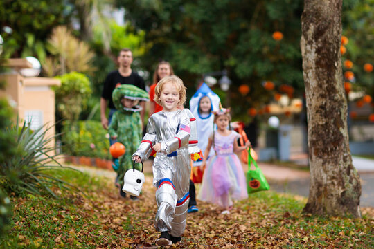 Kids trick or treat. Halloween fun for children.