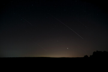 Long exposure photo, night sky, falling star