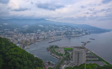 Aerial view of Atami, a seaside resort town southwest of Tokyo, on an overcast summer day