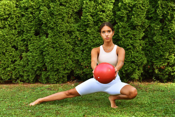 woman doing yoga exercises in the park