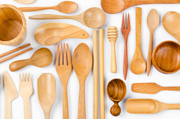 Set of the wooden kitchen utensils on white background.