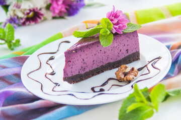 Homemade cheesecake with fresh blueberries and mint for dessert - healthy organic summer dessert pie cheesecake. Creative atmospheric decoration.