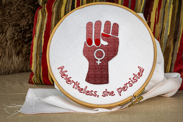 Nevertheless she persisted with raised fist embroidery on hoop, craftivism feminist activism.