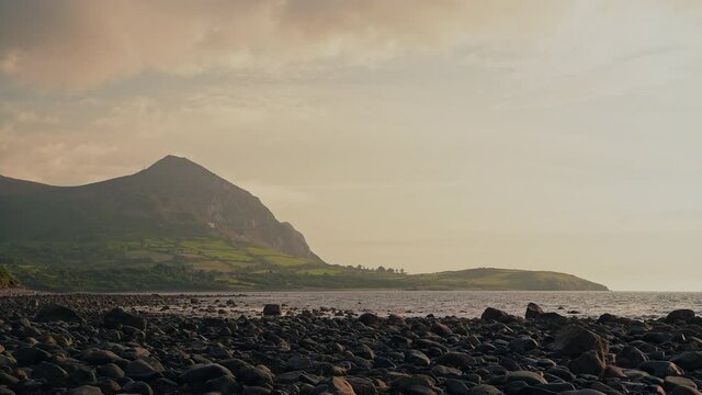 Breathtaking coastal scenery of Llyn Peninsula with golden hour sunlight, static