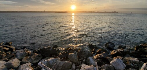 sunset on the rocky shore