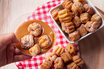 .Homemade mini churros with dulce de leche