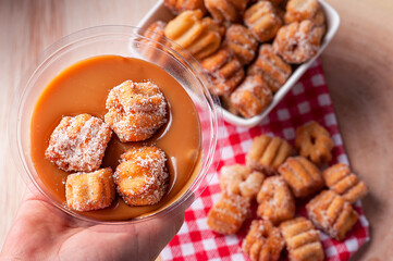.Homemade mini churros with dulce de leche