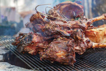 Lamb meat cooked in tandoor during a picnic outdoors.