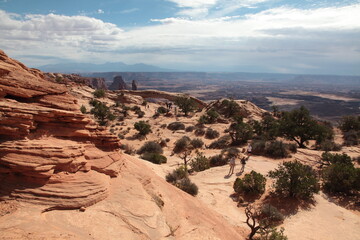Fototapeta premium Aerial view of tourists visiting Mesa Arch at island in the sky in Canyonlands National Park Utah, USA