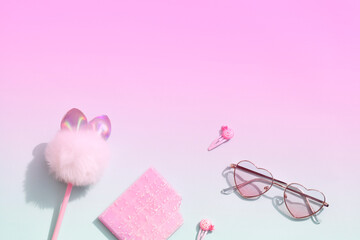 pink school stationery on pink and blue bright background.Back to school minimal concept.