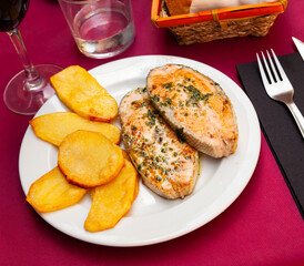 Deliciously steak of baked salmon with greens and potatoes