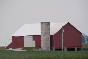 red barn in a cleared field