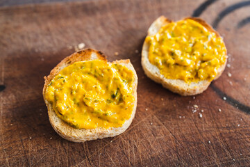 simple food ingredients, bread slices with sweet potoato and kale dip